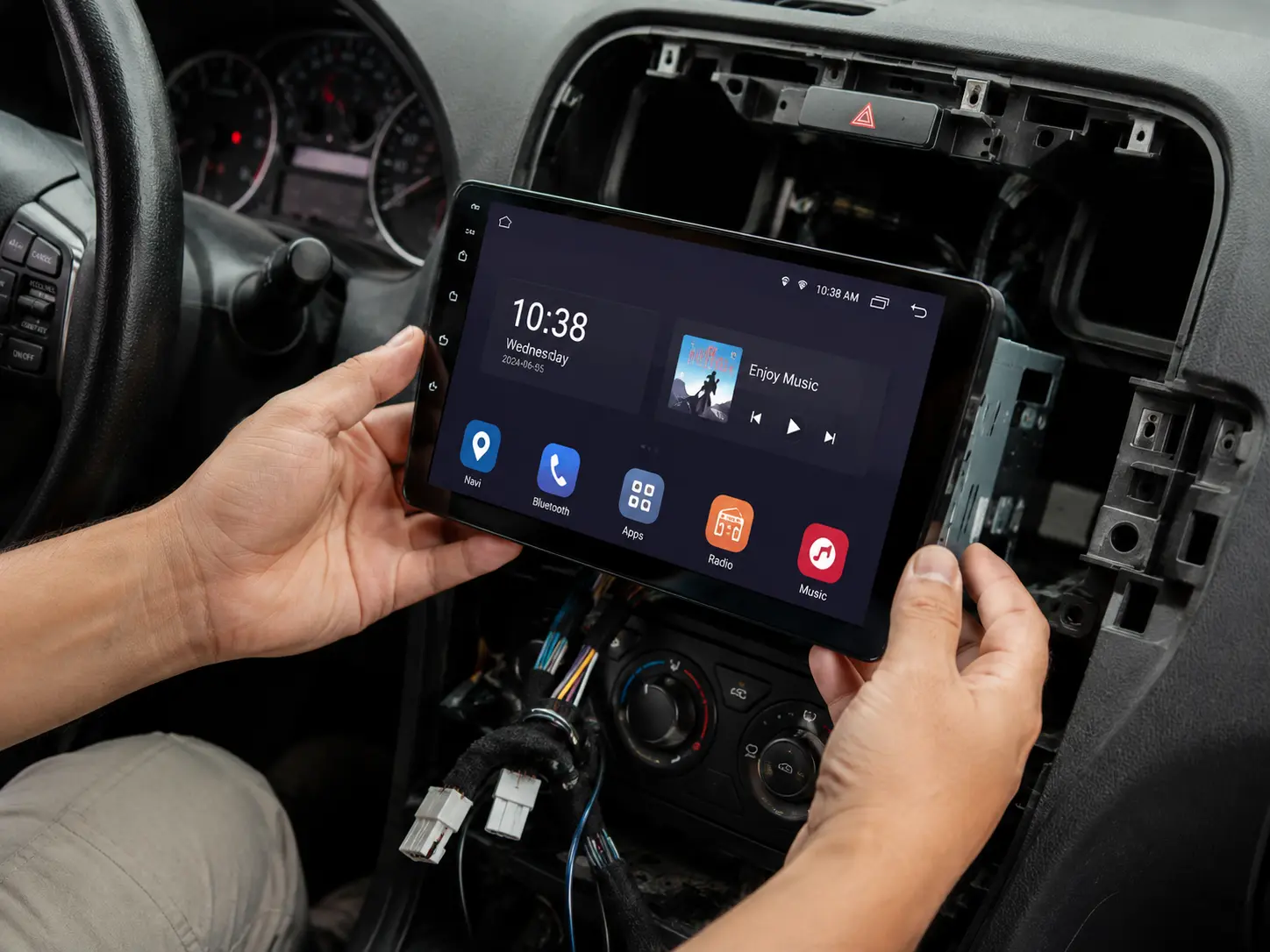 Android head unit with large touchscreen being installed in a vehicle dashboard at Prestige Performance Center