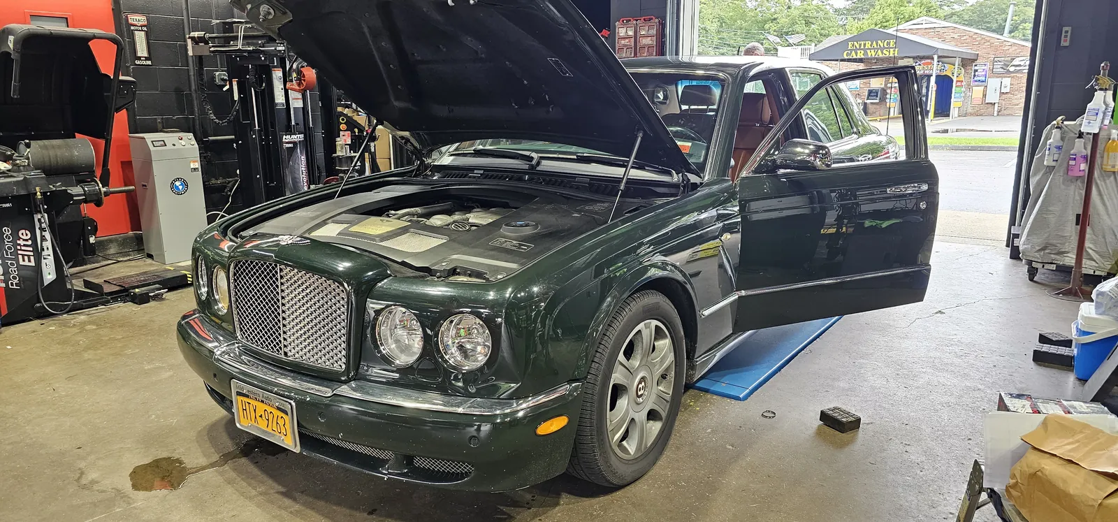 Tire service beside the Hunter Road Force balancer at Prestige Performance Center