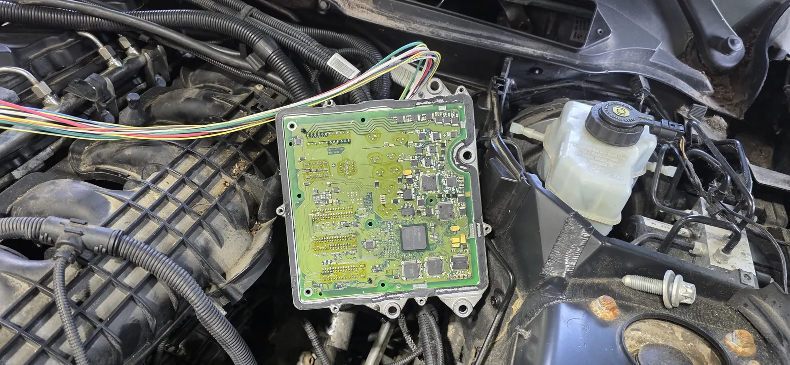 Engine control module opened in the bay — board-level inspection at Prestige Performance Center