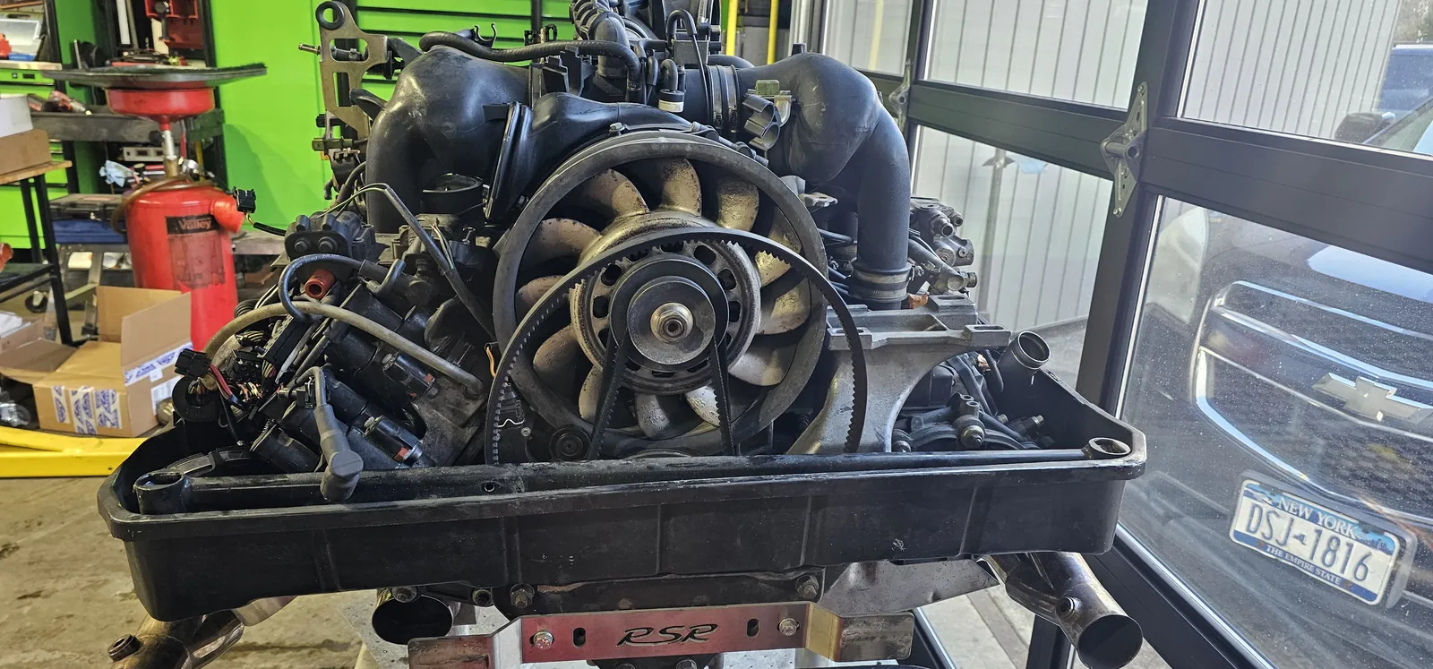 Air-cooled Porsche flat-six on an RSR stand mid-build at Prestige Performance Center