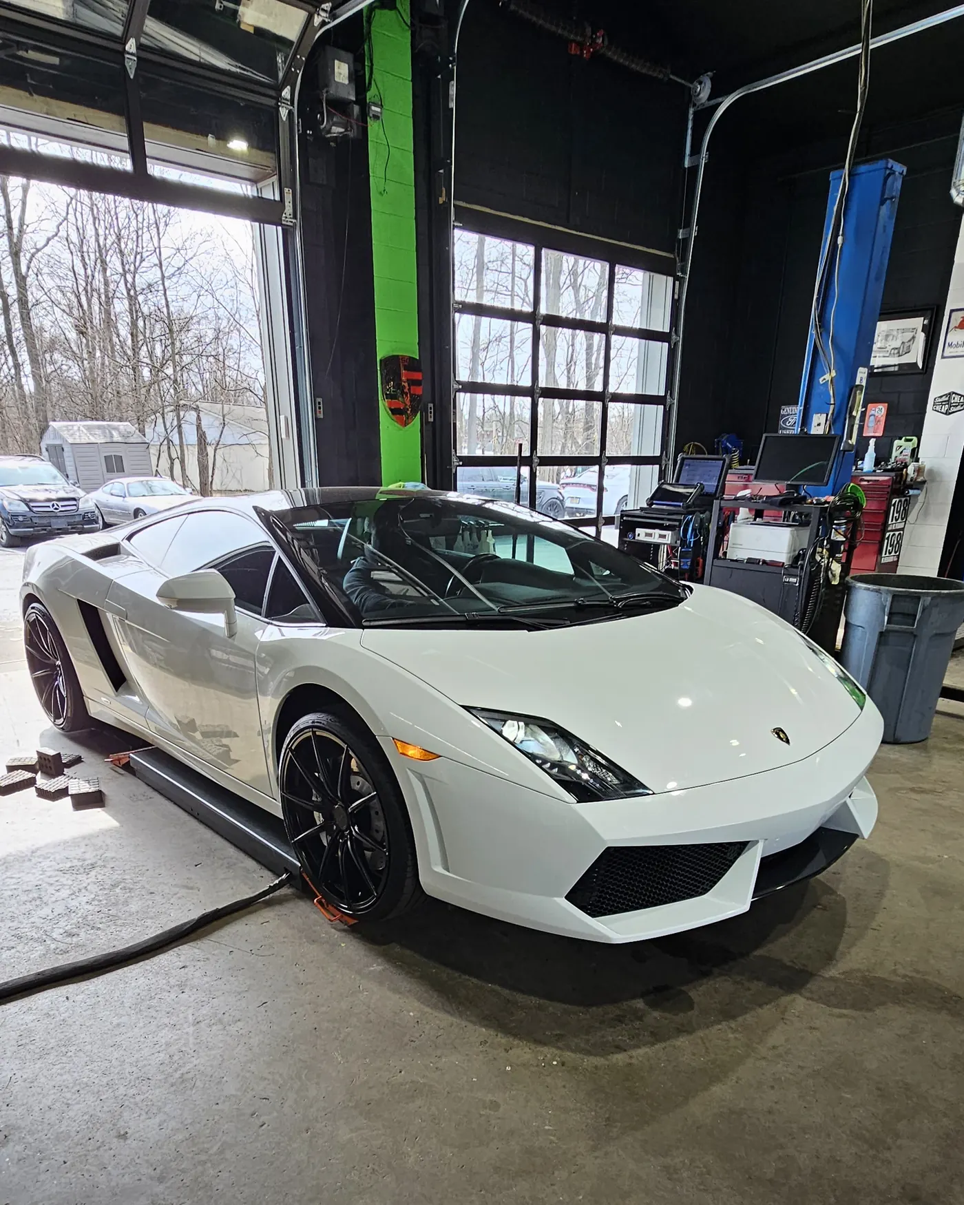 White Lamborghini Gallardo staged in the service bay at Prestige Performance Center