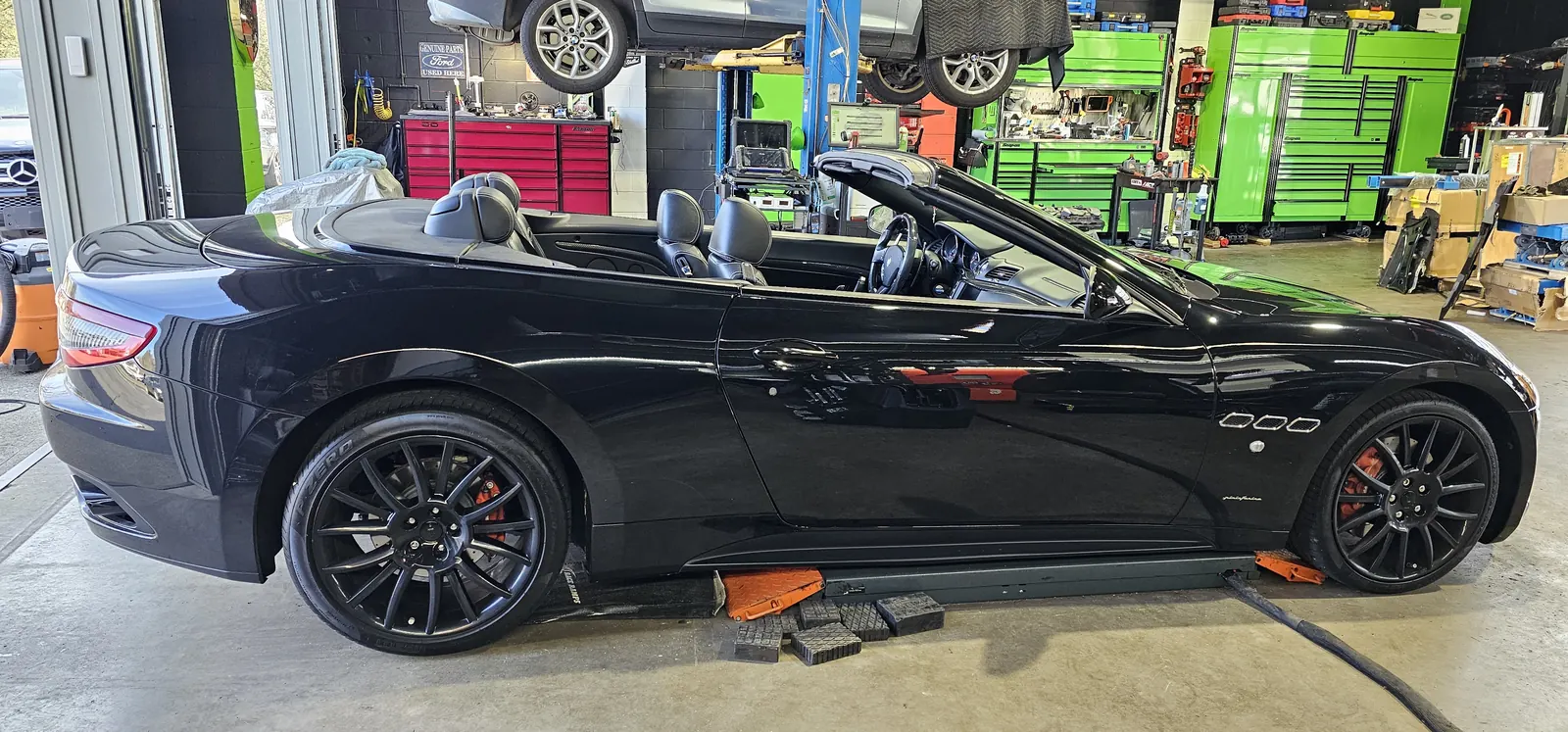 Maserati GranTurismo convertible in the service bay at Prestige Performance Center