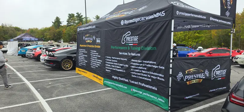 The Prestige Performance Center services wall at the meet