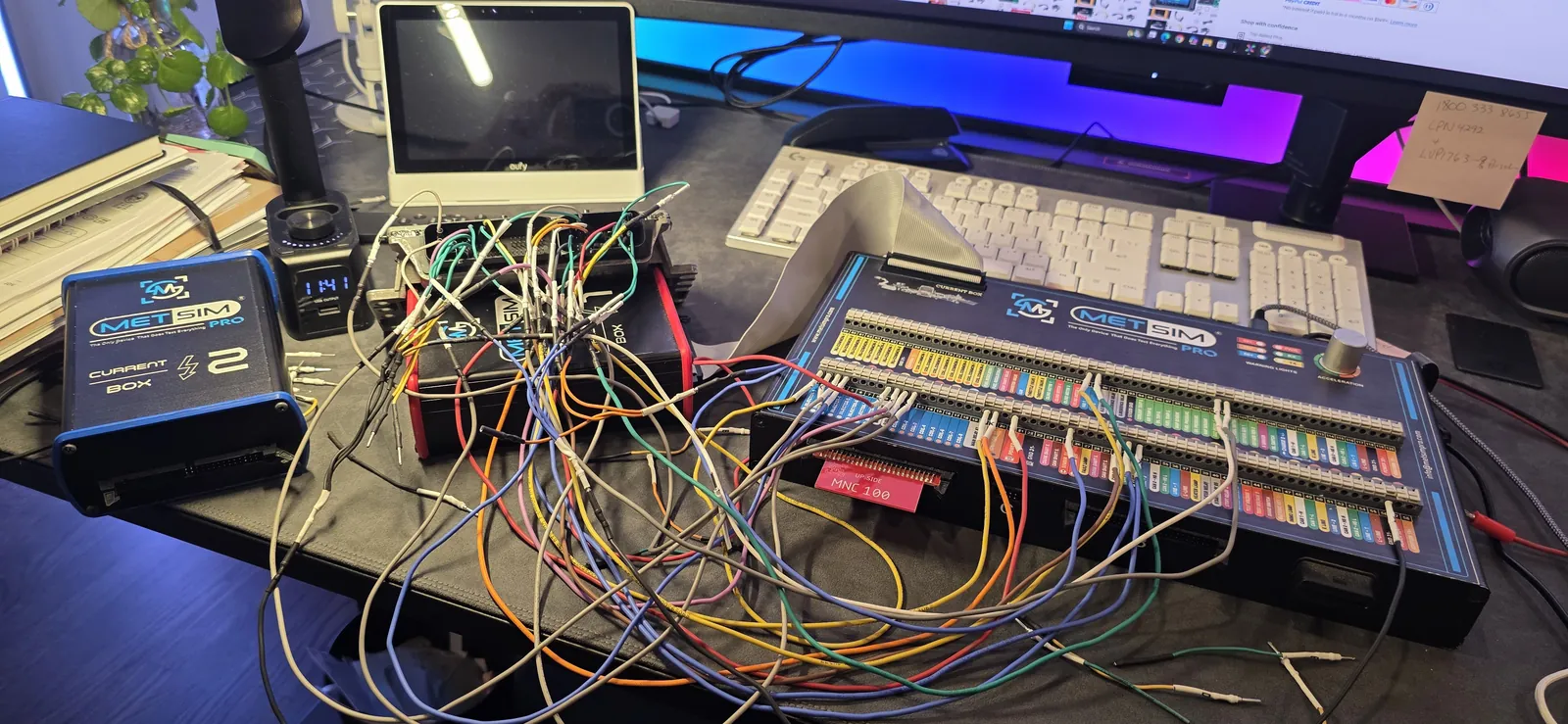 ECU connected to the bench simulator at Prestige Performance Center — full harness breakout for module-level testing