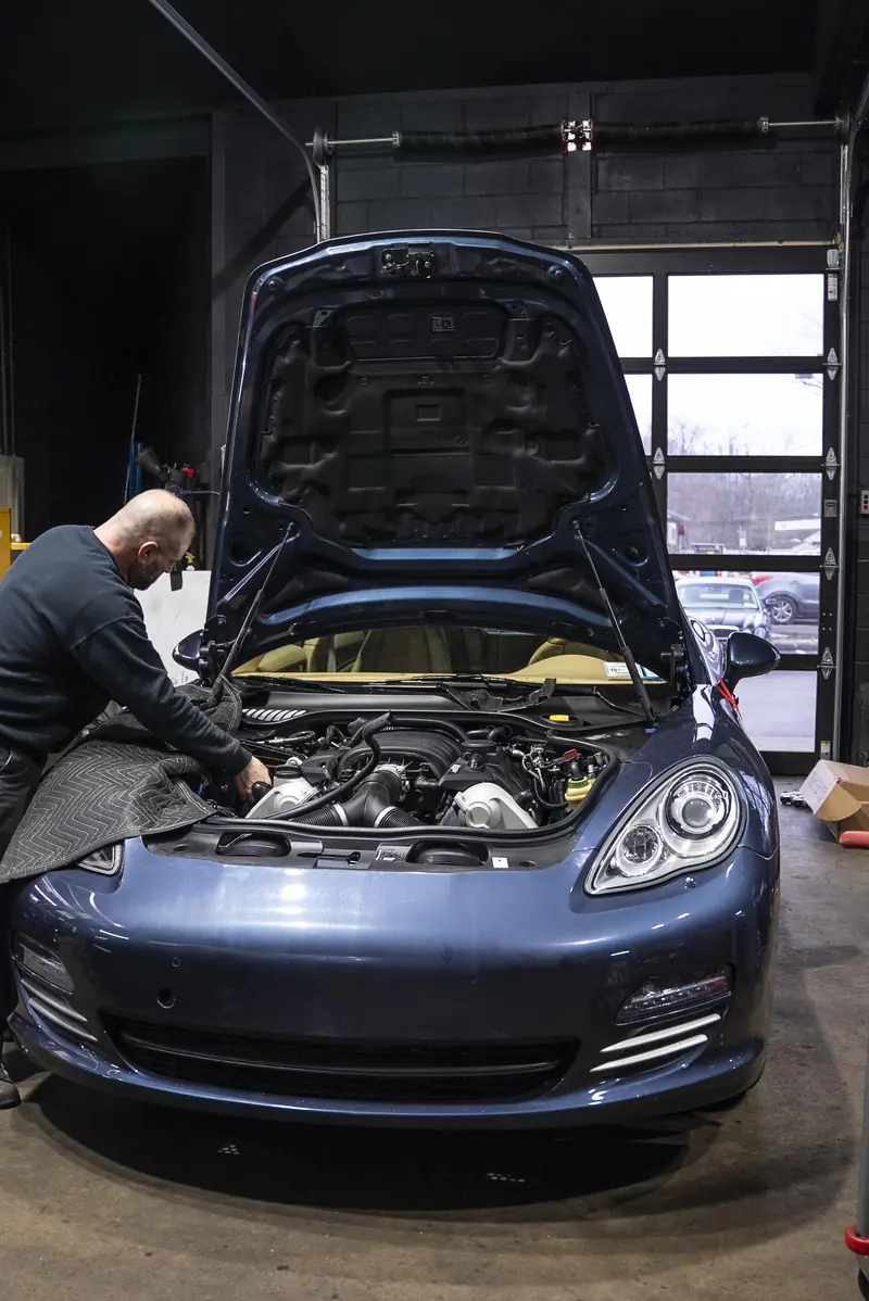 Panamera in the service bay, hood up