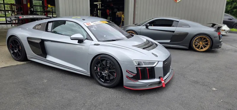 Two R8s at the doors — the GT4 race car and our twin-turbo V10