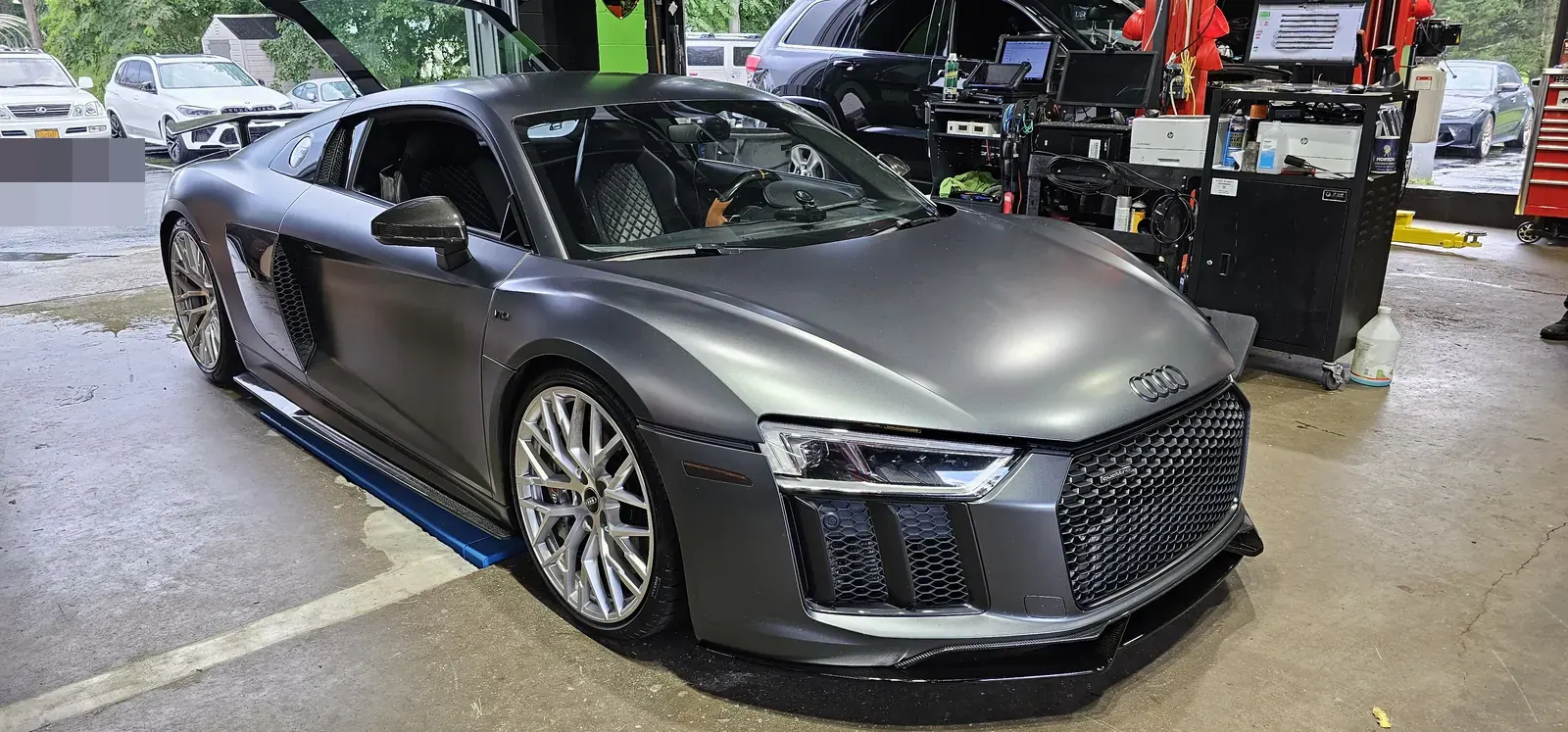 The shop's twin-turbo Audi R8 V10 in the bay at Prestige Performance Center