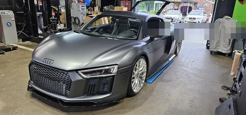 The shop twin-turbo R8 at the bay door