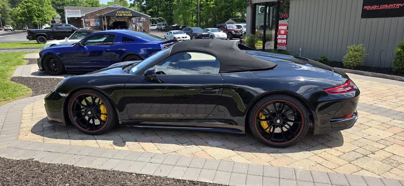 Black 991 Speedster, yellow calipers, in for service