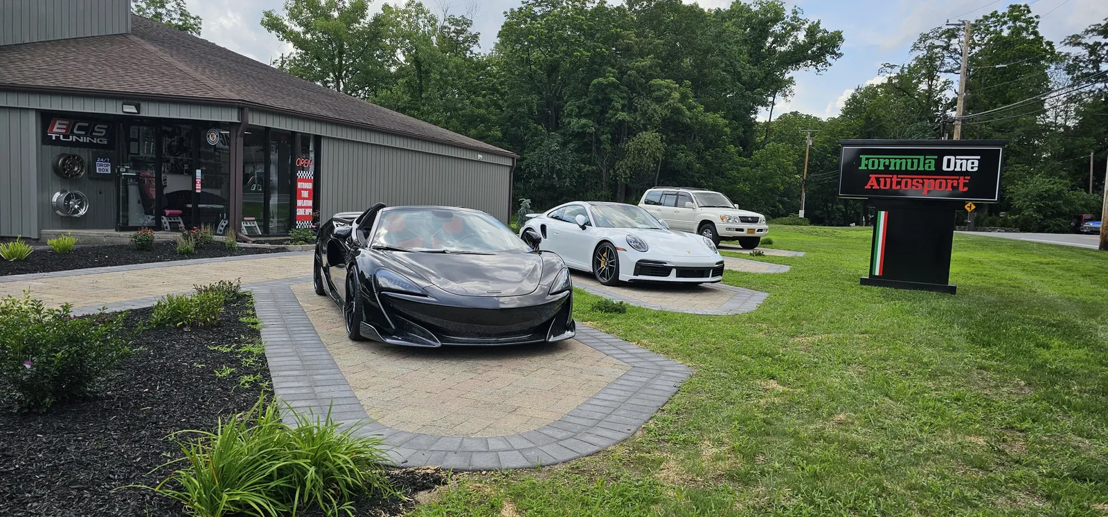McLaren 600LT and 911 Turbo S out front at 476 All Angels Hill Rd