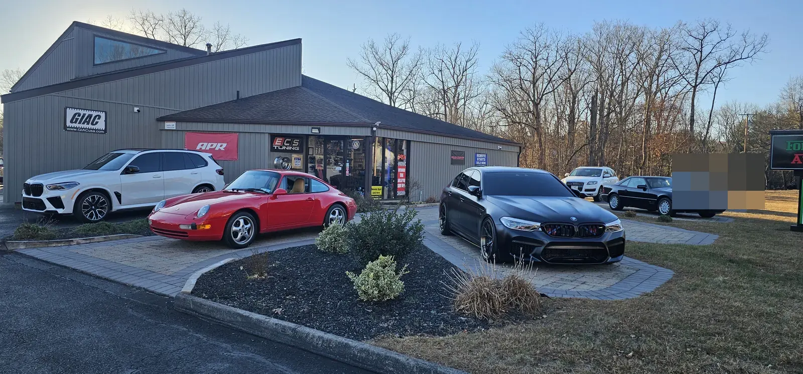 Prestige Performance Center storefront with GIAC, APR, and ECS Tuning dealer signage