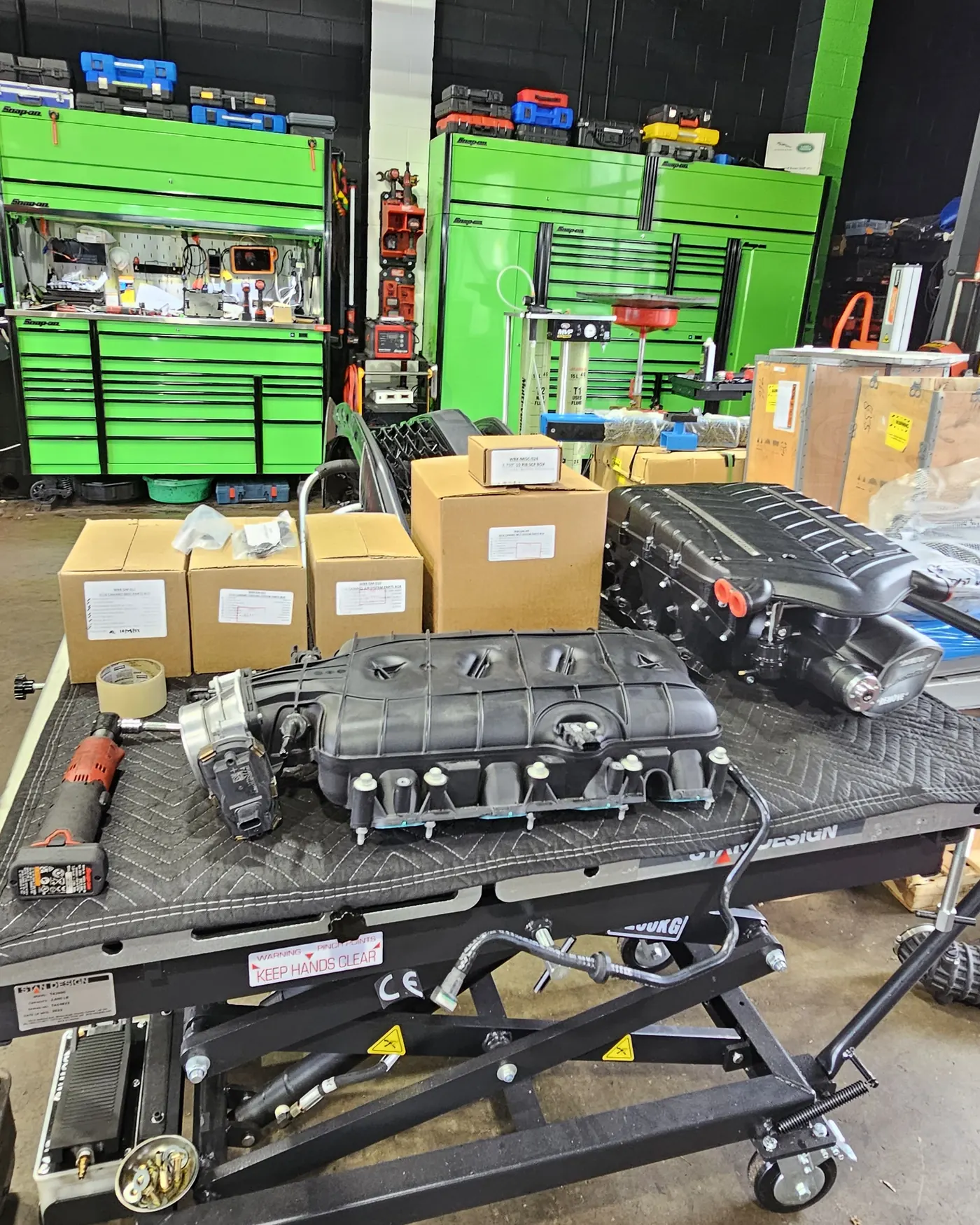 Whipple supercharger kit staged for install — the kind of build financing makes possible now instead of later