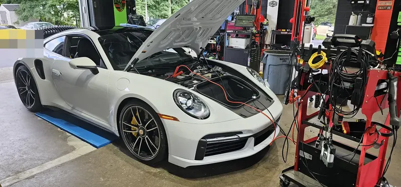 992 Turbo S on the pad, hood up for diagnostics